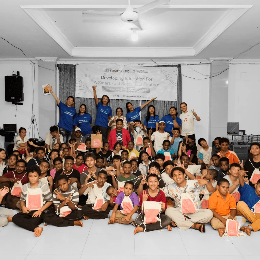 Traders and children supported by the FundYourFX charity program